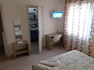 Кровать или кровати в номере Bilocale indipendente a pochi passi dal mare di Rimini