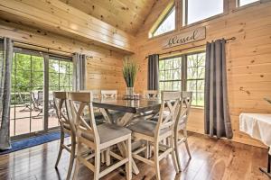a dining room with a table and chairs at Lake View and Hot Tub Wrightsville Cabin! in Wrightsville +31 photos