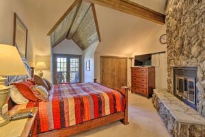 a bedroom with a bed and a fireplace at 2 Mi to Lake Dillon Spacious Condo with Mtn Views in Dillon