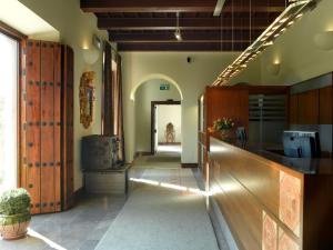 a hallway of a home with a kitchen with a counter at Parador de Granada in Granada