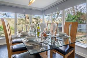a dining room with a glass table and chairs at Valley View in Paul