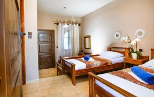 Posteľ alebo postele v izbe v ubytovaní Gregory Village Sea View