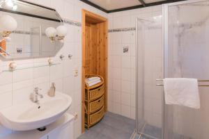 a bathroom with a sink and a shower at Tine in Ahrenshoop