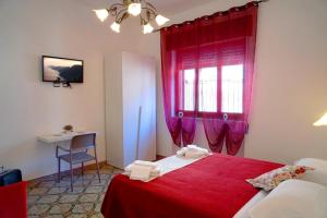 En eller flere senge i et værelse på Angolo Fiorito