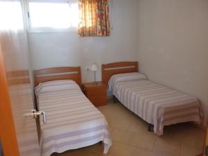 Postel nebo postele na pokoji v ubytování JOYAPARTMENTS Gavina D´Or