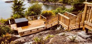 a wooden bridge over a body of water at 378 Marine Drive in Ucluelet