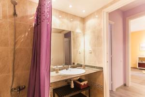 a bathroom with a sink and a mirror at Be Barcelona Eixample Urquinaona II in Barcelona +208 photos