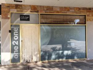 a store front with a large glass door at Indulge Apartments - Eighth in Mildura