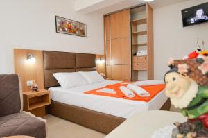 Säng eller sängar i ett rum på Apartments Ivanović