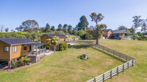 an aerial view of a home with a large yard at Hazelcreek Cottages in Exeter