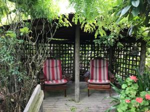 two chairs sitting under a gazebo at Hillside Bed and Breakfast in Huonville