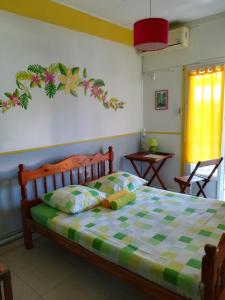 Postel nebo postele na pokoji v ubytování Hotel De la Plage