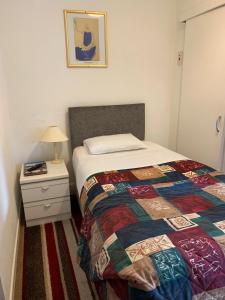 A bed or beds in a room at Strathpeffer Hotel 