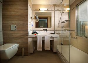 a bathroom with a sink and a toilet and a shower at Prime Boutique Hotel in Antalya