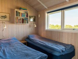 Postel nebo postele na pokoji v ubytování Holiday home Fanø LXX