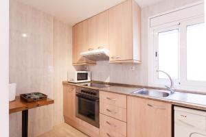 Kuchyň nebo kuchyňský kout v ubytování Patio Budget Apartment 12