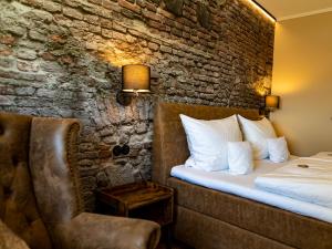 מיטה או מיטות בחדר ב-Hotel Zum Burggraf