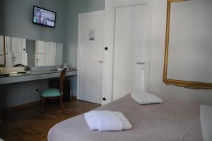 Posteľ alebo postele v izbe v ubytovaní Sweet Home Parioli
