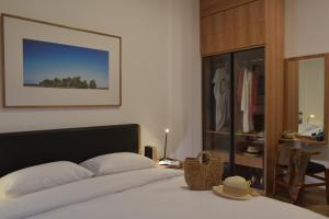 Tempat tidur dalam kamar di Rumanami Residence
