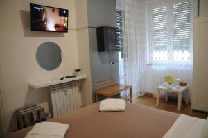 Posteľ alebo postele v izbe v ubytovaní Sweet Home Parioli