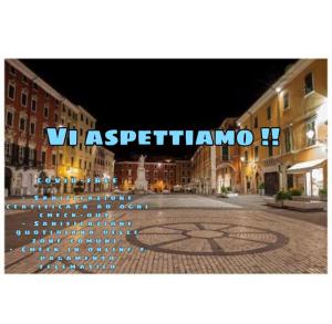 a city street at night with the words spectoramn at Alberica10 in Carrara