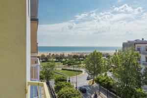 a view of the beach from a building at Hotel City in Rimini