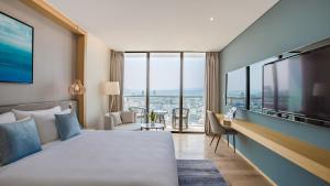Giường trong phòng chung tại Sel de Mer Hotel & Suites