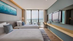Giường trong phòng chung tại Sel de Mer Hotel & Suites