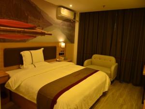 Krevet ili kreveti u jedinici u objektu Thank Inn Chain Hotel Jiangxi Fuzhou Linchuan District Donghua University of Technology