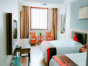 เตียงในห้องที่ JUN Hotels Lu'an Huoshan County Huayuan Road