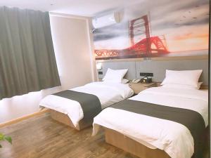 two beds in a hotel room with a painting on the wall at Thank Inn Plus Hotel Jiangsu Suzhou Taicang Liuhe Town Tinghai Road in Taicang +5 photos