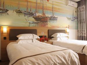 Posteľ alebo postele v izbe v ubytovaní JUN Hotels Dezhou Lincheng District Bus Station