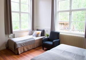 Postel nebo postele na pokoji v ubytování Guesthouse Eleven Hotel