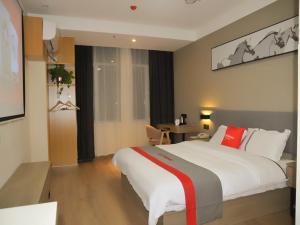 Krevet ili kreveti u jedinici u objektu JUN Hotels Shandong Liaocheng Eco-Tech Development Zone Contmporary International Plaza