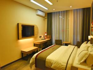 Voodi või voodid majutusasutuse Thank Inn Chain Hotel Huaihua Tongdao Bus Station toas