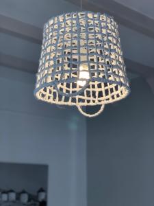 a light fixture hanging from a ceiling at Noufaro in Mylopotas