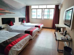 Llit o llits en una habitació de JUN Hotels Nanchang Honggutan New District Cuiyuan Road Subway Station