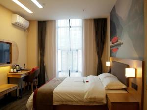 Voodi või voodid majutusasutuse Thank Inn Chain Hotel Jiangsu Yangzhou Gaoyou Shangcheng International toas
