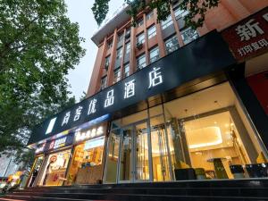 a store with chinese writing on the front of a building at Up And In Henan Anyang Hongqi Road Wal-Mart in Anyang