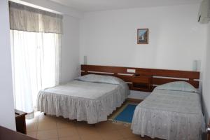 Un pat sau paturi într-o cameră la Dom Fernando I