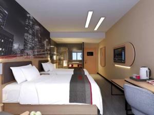 Krevet ili kreveti u jedinici u okviru objekta Thank Inn Chain Hotel Shandong Binzhou Yangxin Yinzuo Store