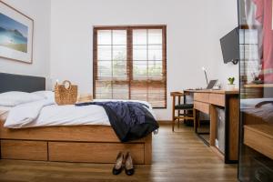 A bed or beds in a room at Rumanami Residence