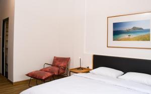 A bed or beds in a room at Rumanami Residence