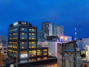 a building with aania on top of it in a city at APA Hotel Akihabara Ekimae in Tokyo