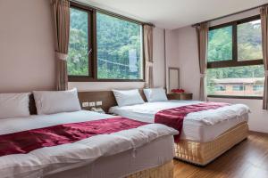 מיטה או מיטות בחדר ב-Sin Ging Hong Resort