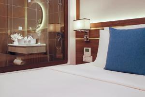 Postel nebo postele na pokoji v ubytování Seana Hotel