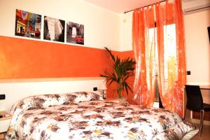 A bed or beds in a room at La Baia del Lago