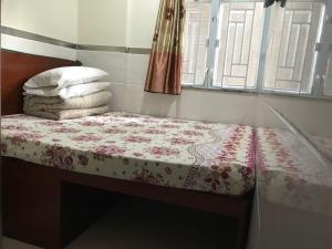 Cama o camas de una habitación en E-Dragon Hotel 一龙酒店