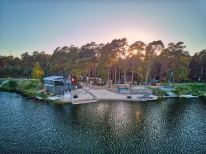 a park next to a body of water at BB camping in Liepāja