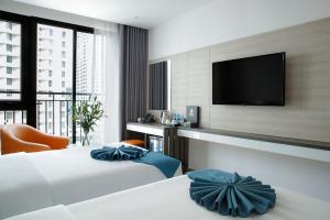 TV a/nebo společenská místnost v ubytování Seana Hotel